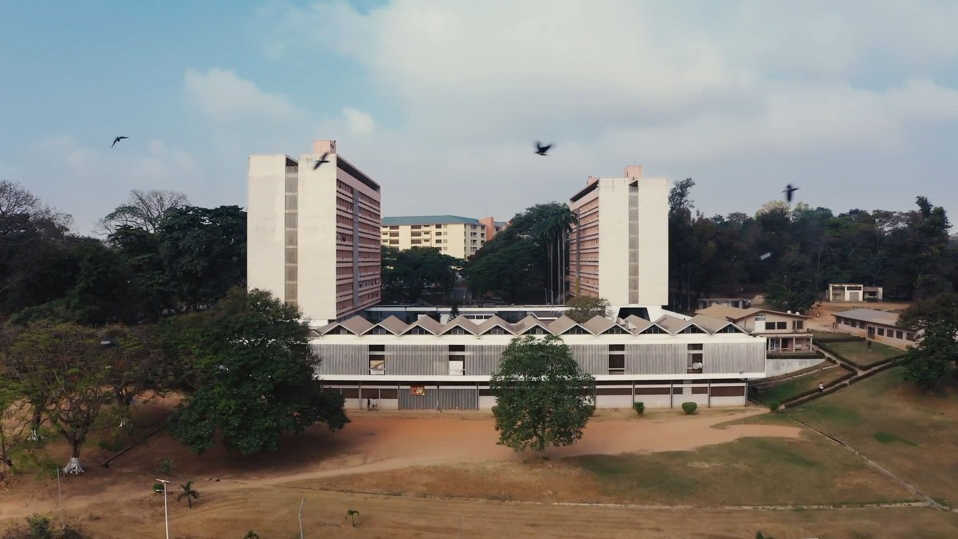 John Owuso Addo and Miro Markovic, Unity Hall, KNUST campus, Kumasi, 1963. Film still from 'Tropical Modernism: Architecture and Independence', Dir.: Christopher Turner, Bushra Mohamed, Nana Biamah-Ofosu; Cameraman, Charlie Laing, 2023. V&A Publications.