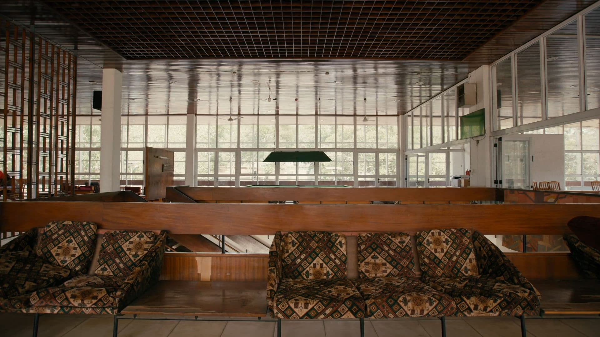 John Owuso Addo, Miro Markovic and Nikso Cico, Senior Staff Clubhouse, 1964. Film still from 'Tropical Modernism: Architecture and Independence', Dir.: Christopher Turner, Bushra Mohamed, Nana Biamah-Ofosu; Cameraman, Charlie Laing, 2023. V&A Publications.