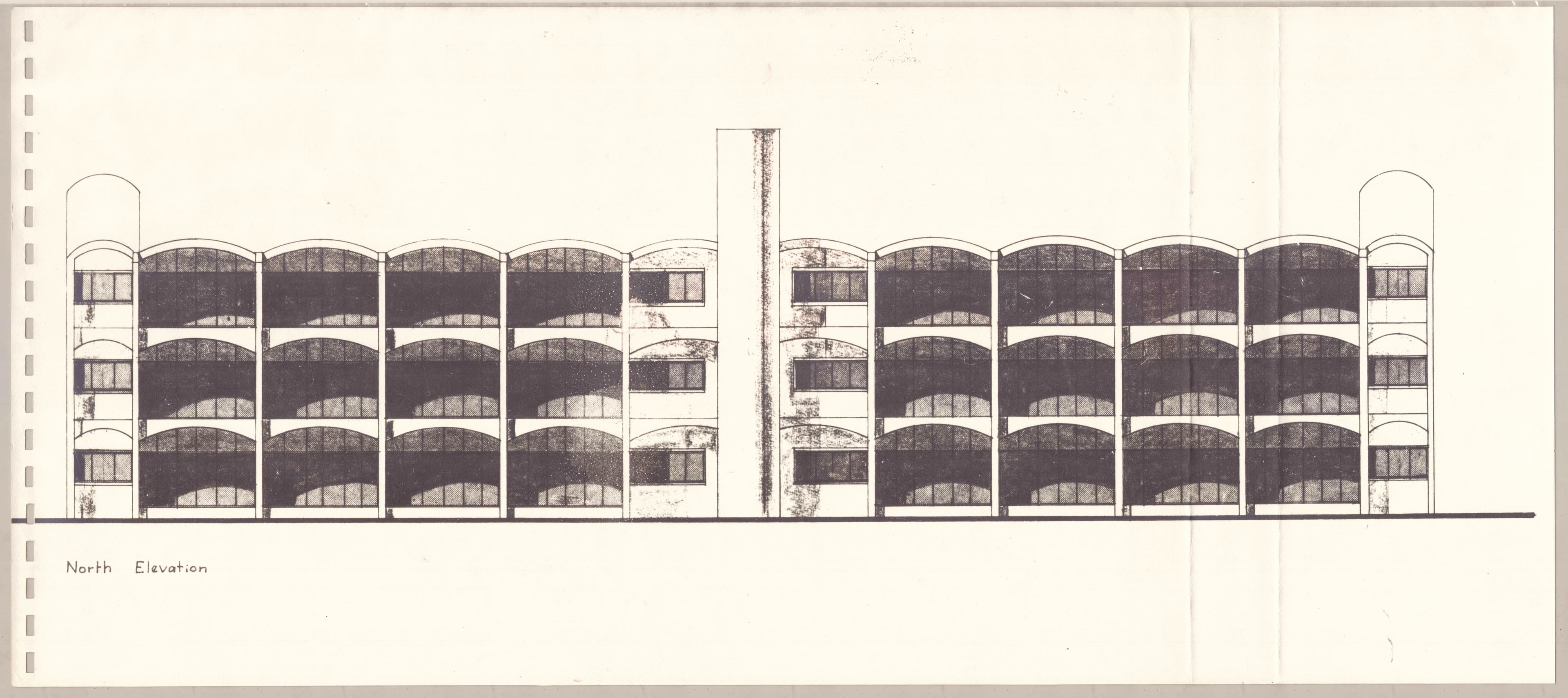 Architectural elevation drawing of a symmetrical multi-story building with balconies.