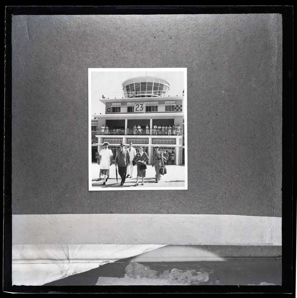 DTA Lantern Slide Library. Slide taken from an unidentified publication, showing a photograph of a welcoming ceremony at the Dar es Salaam Airport in Dar es Salaam, Tanzania in the 1950s. 