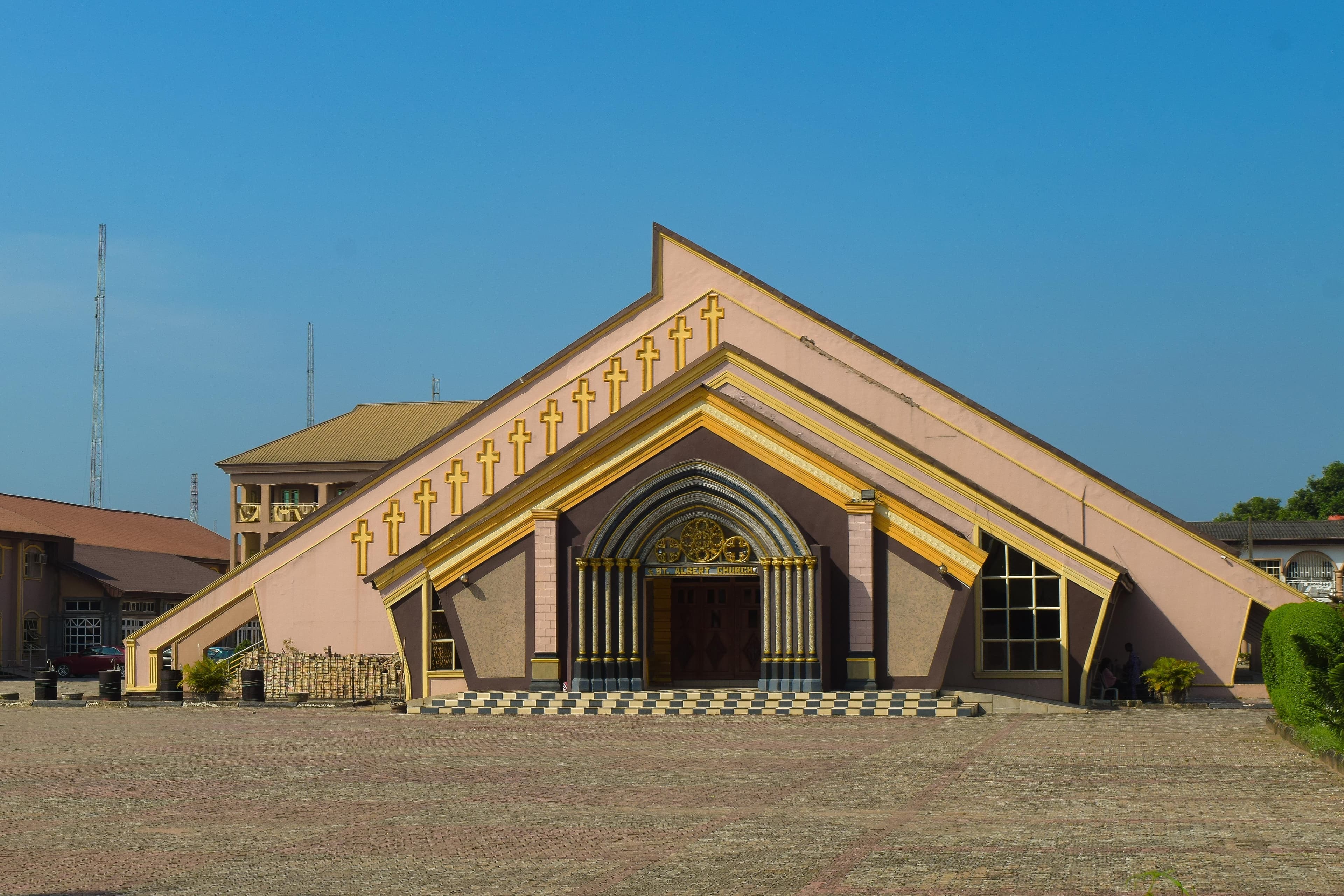 Modern church building with a striking angular roofline and arched entrance.