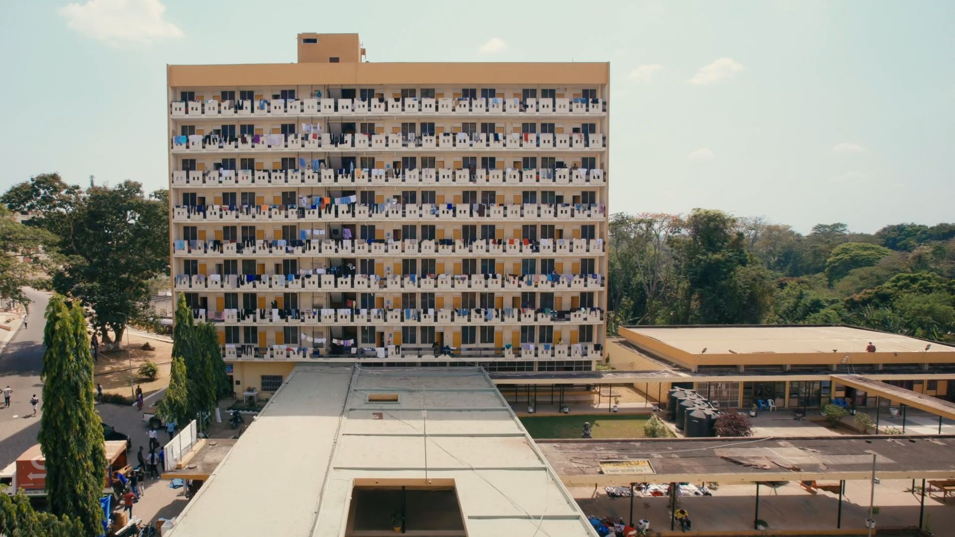John Owuso Addo, Miro Markovic and Nikso Cico, Africa Hall, KNUST campus, Kumasi, 1965. Film still from 'Tropical Modernism: Architecture and Independence', Dir.: Christopher Turner, Bushra Mohamed, Nana Biamah-Ofosu; Cameraman, Charlie Laing, 2023. V&A Publications.