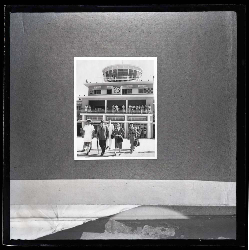 DTA Lantern Slide Library. Slide taken from an unidentified publication, showing a photograph of a welcoming ceremony at the Dar es Salaam Airport in Dar es Salaam, Tanzania in the 1950s. 