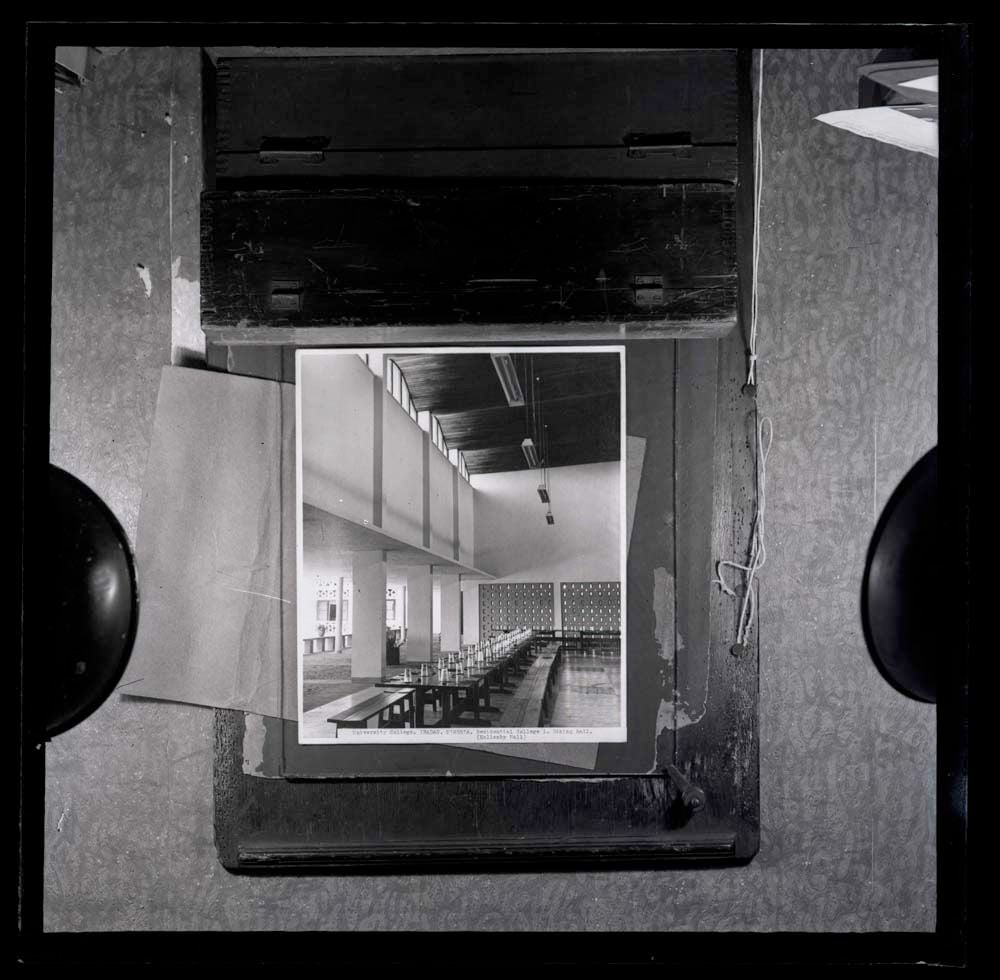DTA Lantern Slide Library. Slide taken from an unidentified publication, showing a photograph of the interior of the dining hall of Mellanby Hall, residential college 1 of the University College in Ibadan, Nigeria.